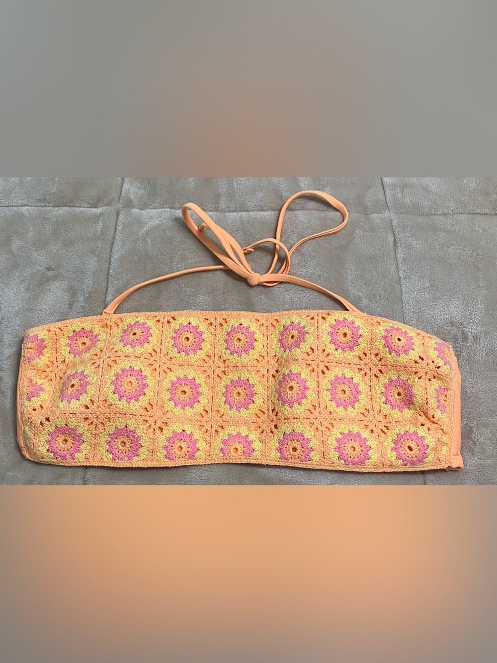 Pink, orange, and yellow bandeau swim top
